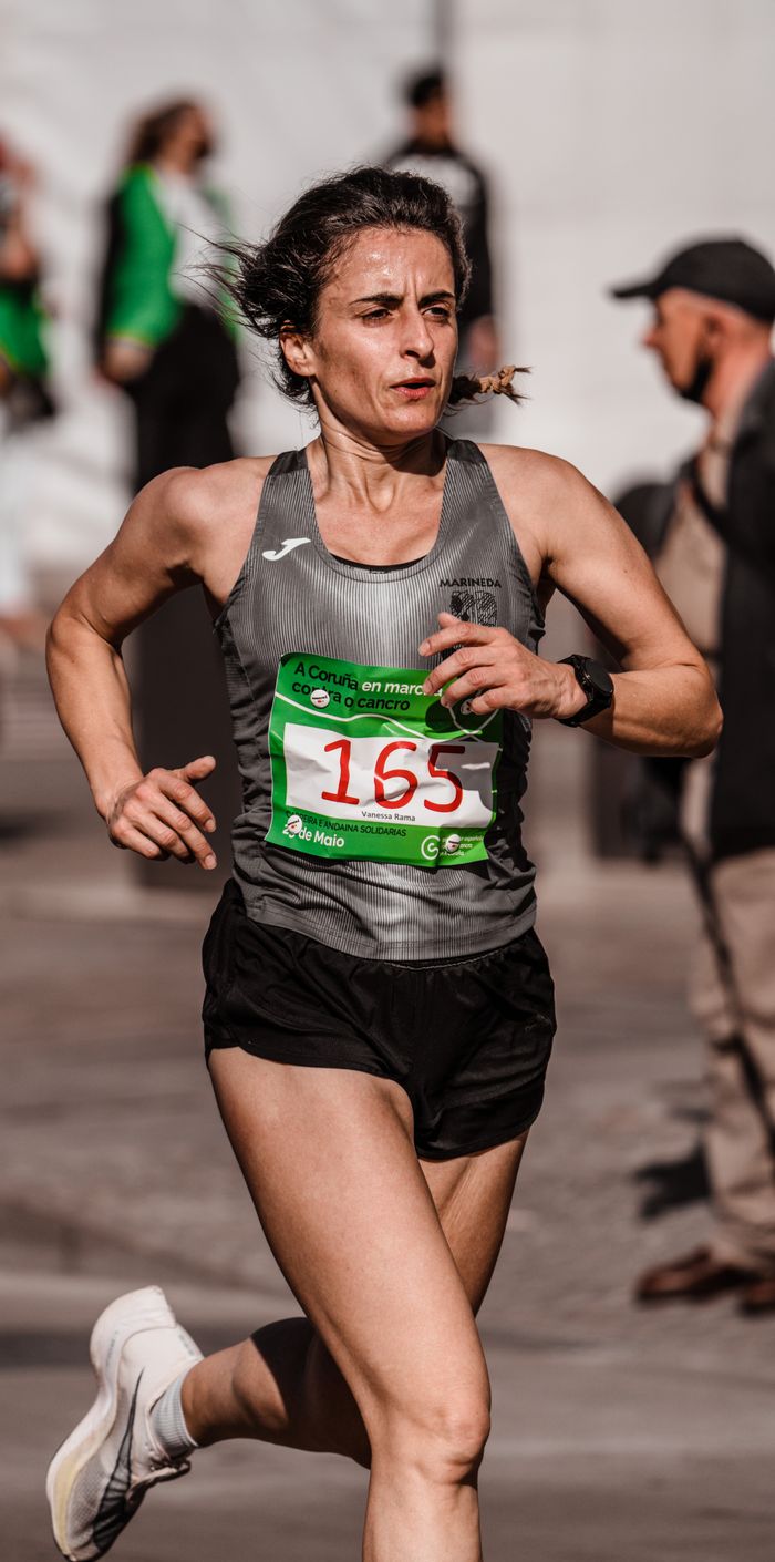 Athletic woman participating in a race with determination and speed.